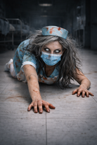 Person in a horror-themed nurse costume on a floor