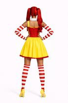 Person wearing a red and yellow costume with striped socks on a white background