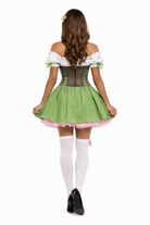 Woman wearing a green and white beer girl costume with a white background