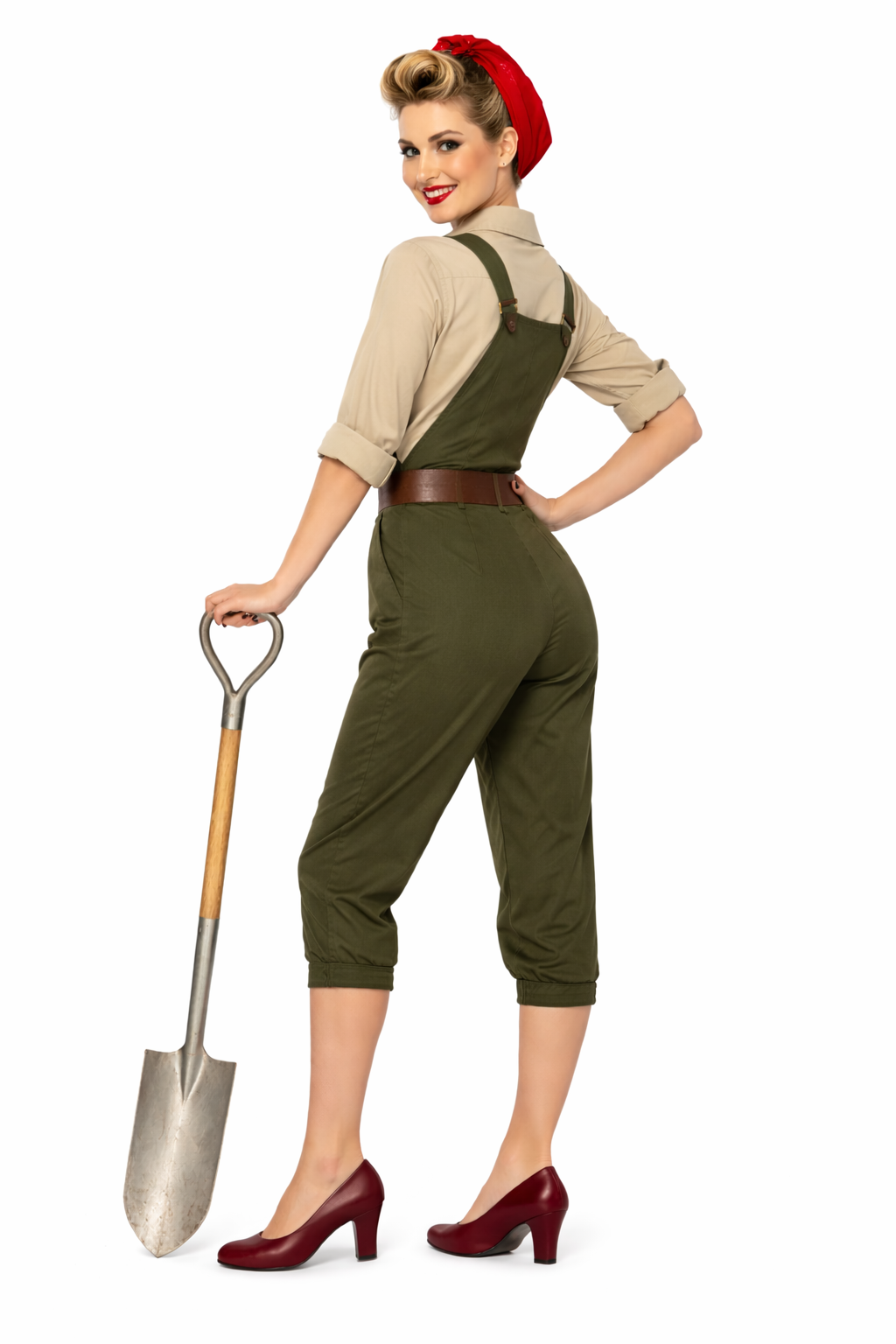 Woman in a vintage-style outfit with green overalls and red beret holding a shovel on a white background