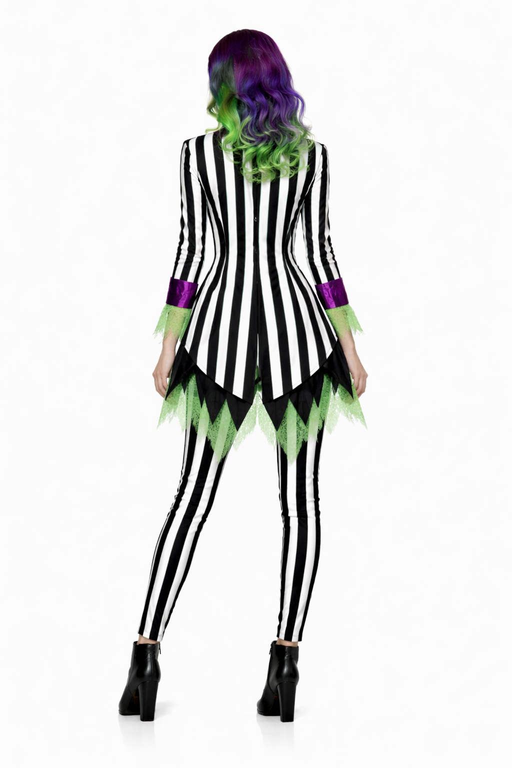 Person wearing a black and white striped dress with green accents on a white background